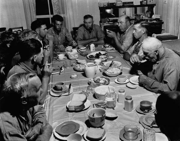 Image 1 - Farmers around a table eating